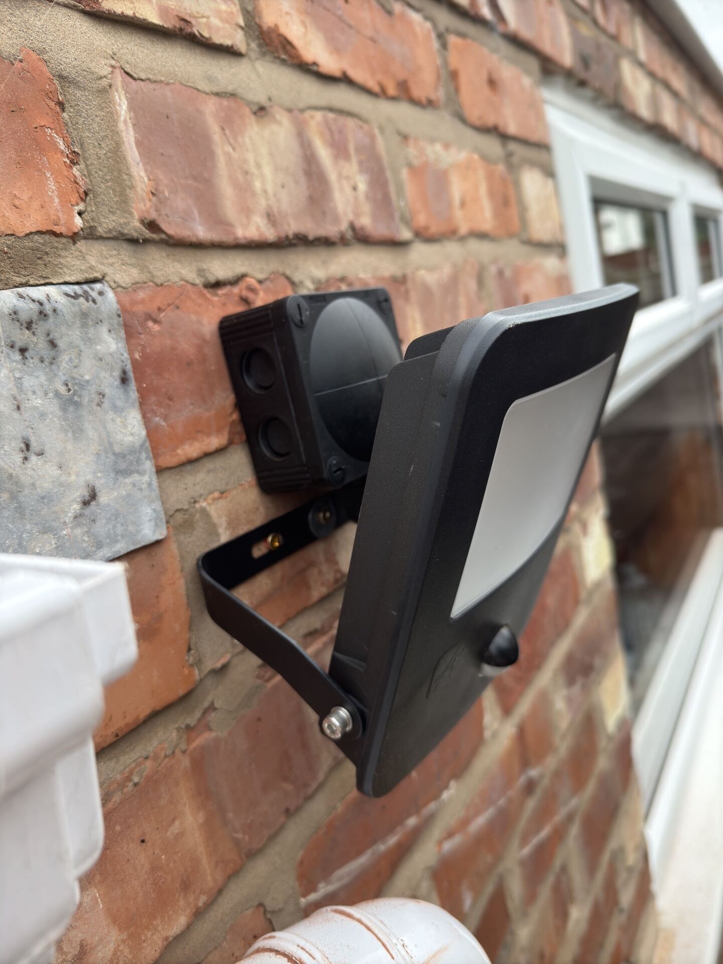 External LED floodlight with PIR sensor installed