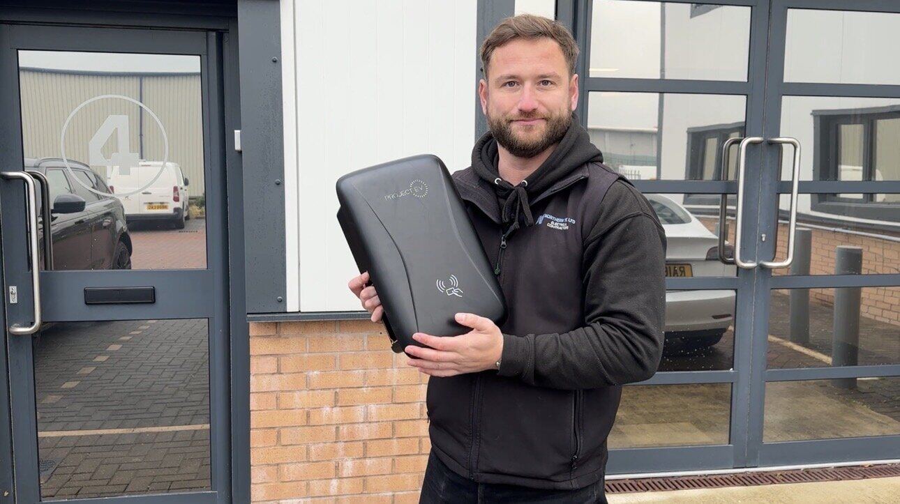 Northern Tec director with a new Project EV smart charger ready for a Fylde Coast installation
