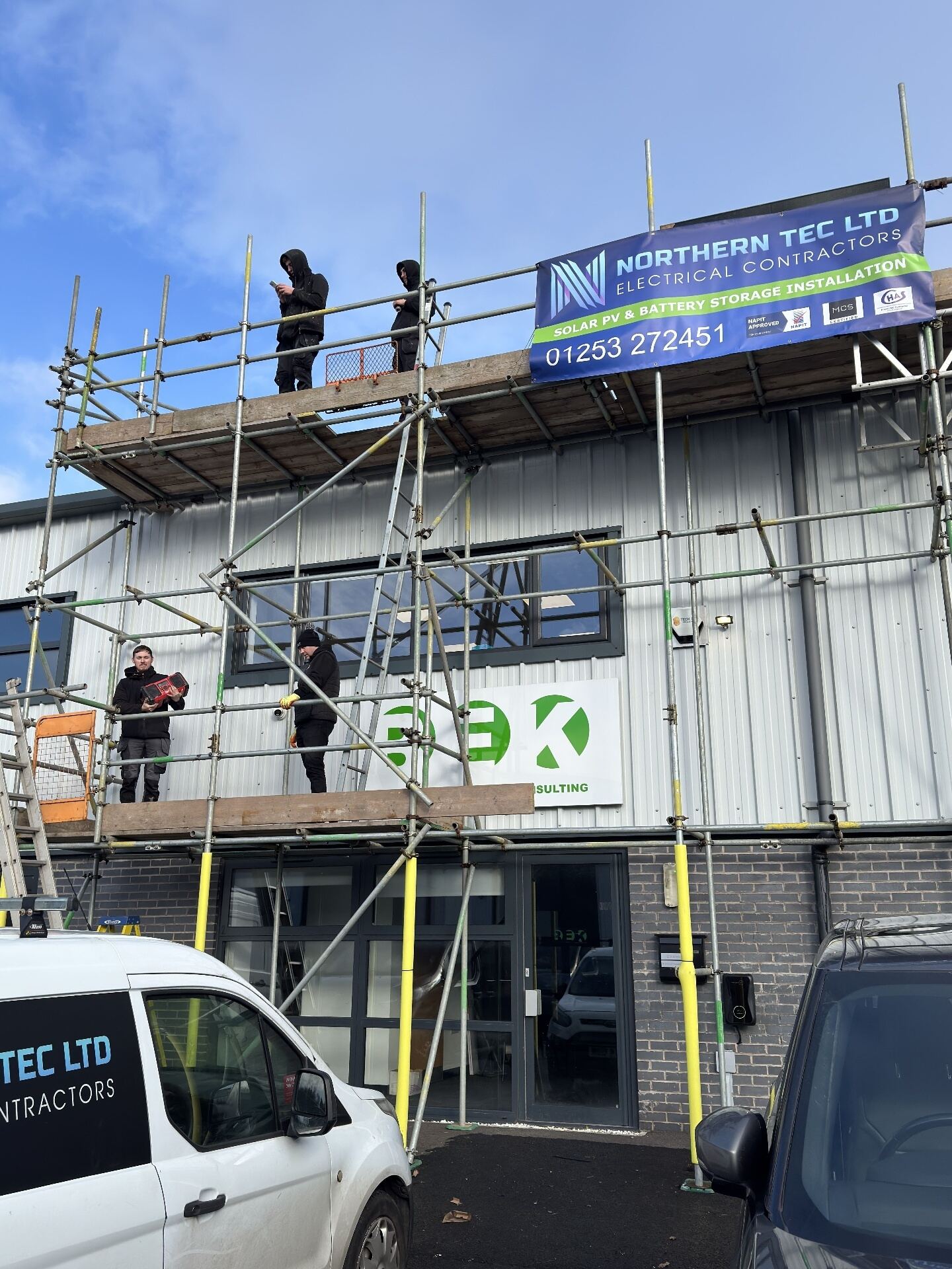 Scaffolded commercial solar PV installation in progress